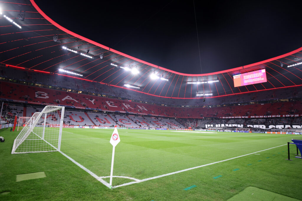 Football stadium at night with empty stands.