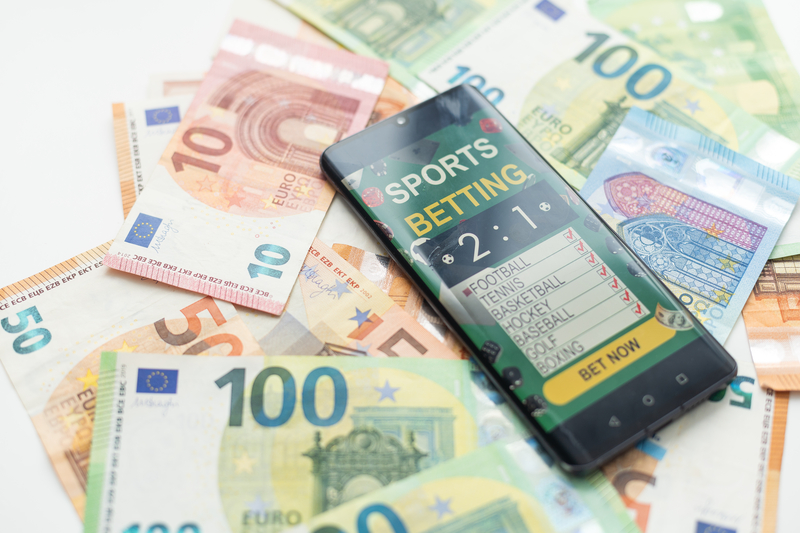 Sports betting app on banknotes