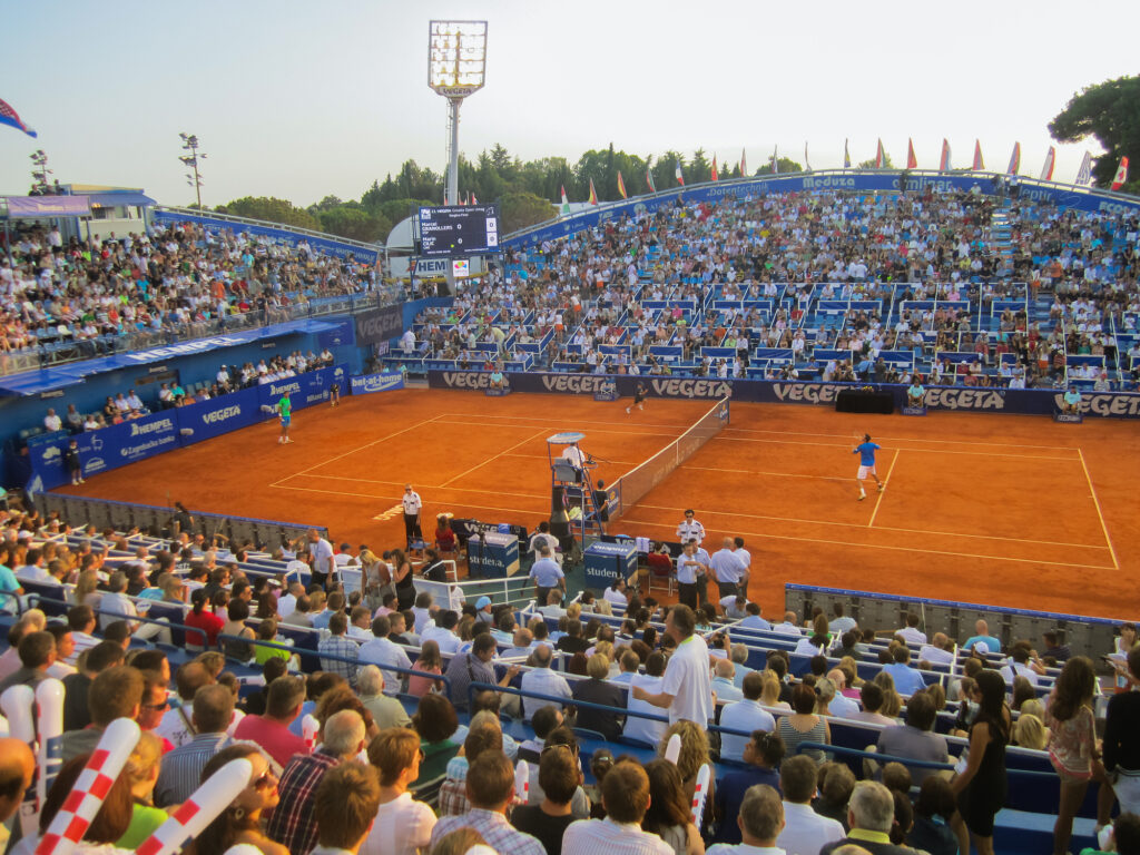 Full outdoor tennis tournament on clay court