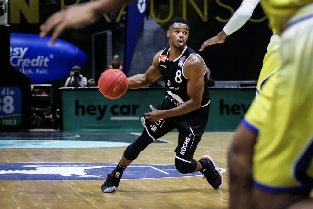 Basketball player dribbles the ball during a game