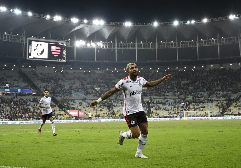 Footballer cheers after scoring a goal in the stadium